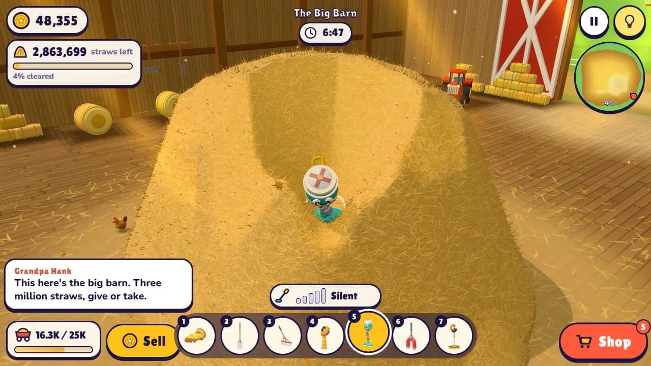 A hay vacuum digs a deep crater in the 3,000,000-straw stack inside The Big Barn