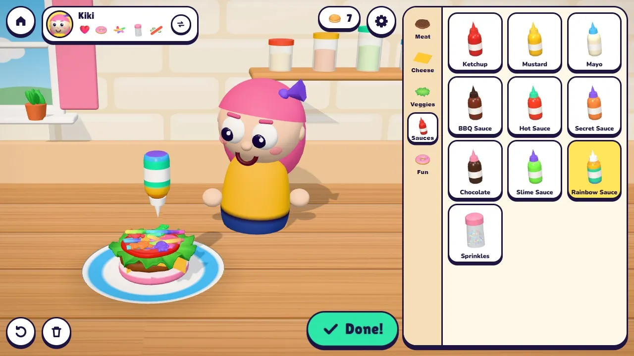 Drawing rainbow sauce on the burger with a squeeze bottle
