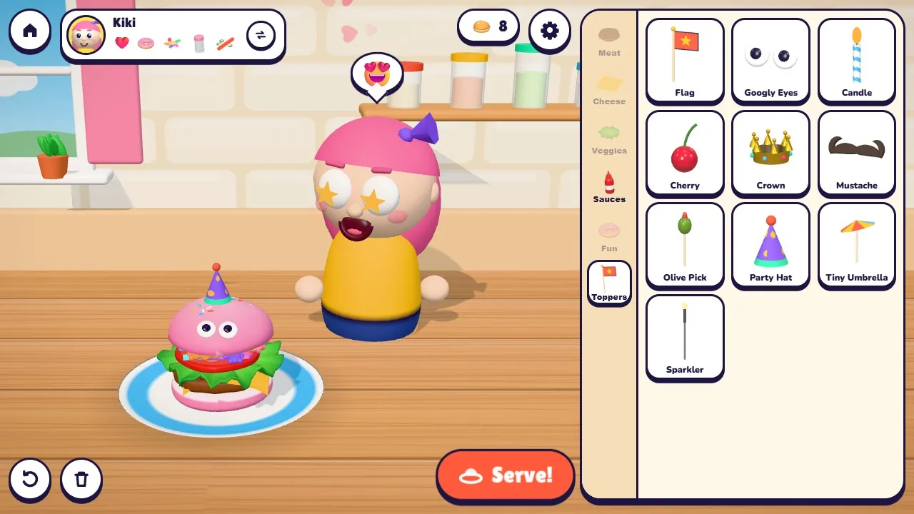 Decorating the top bun with googly eyes and a party hat
