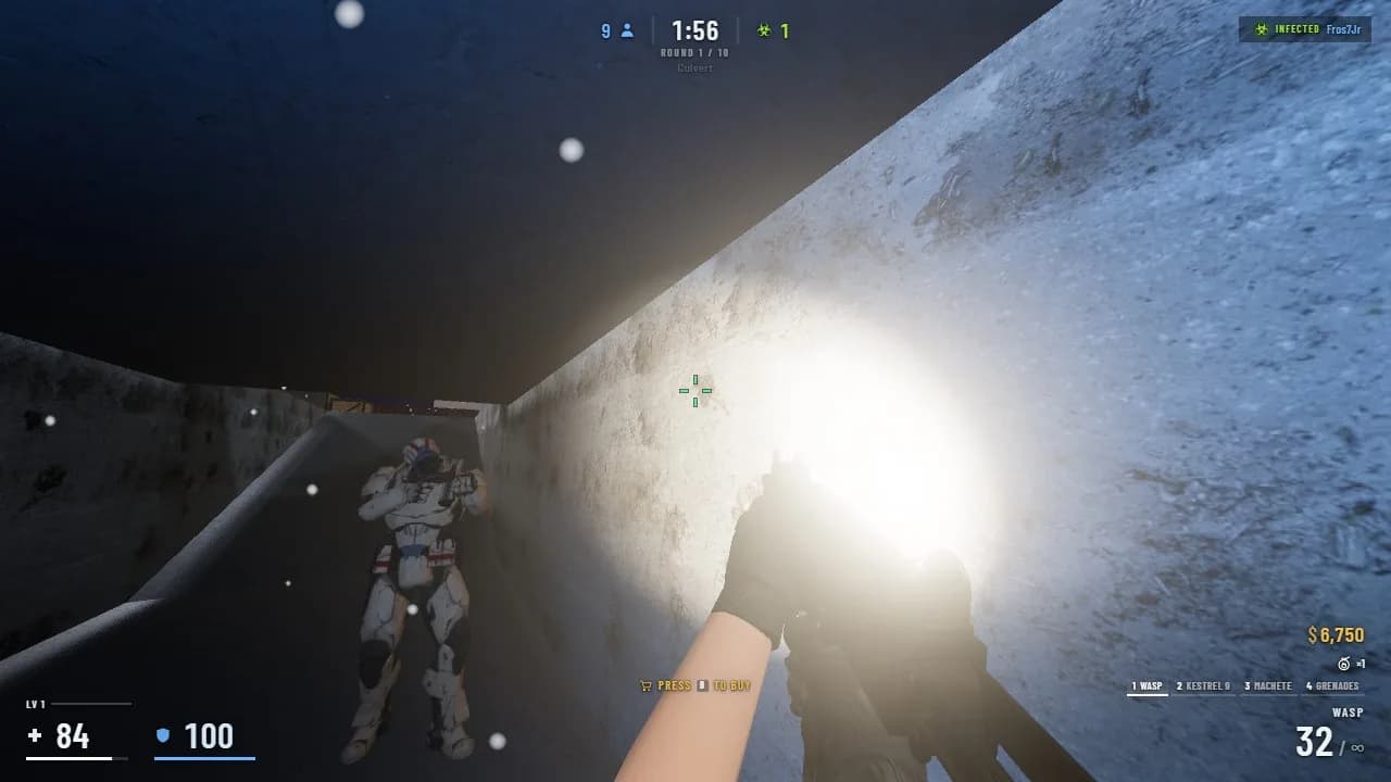 Holding the culvert with a flashlight while a teammate watches the other way